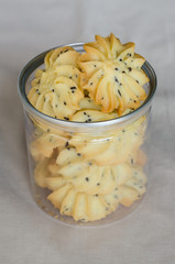 Homemade Sesame Butter Cookies In Transparent Bottle.