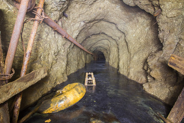 Underground mine shaft gold copper ore tunnel gallery with sulfur water flood
