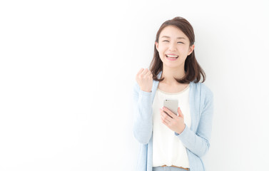 スマートフォン・ガッツポーズ・女性