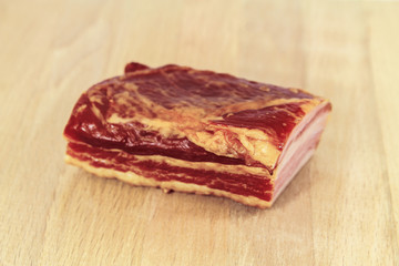 A piece of raw smoked meat