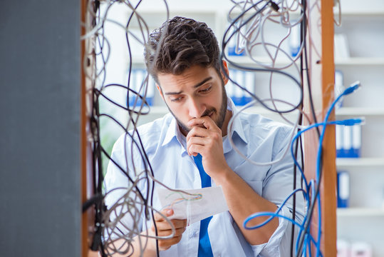 Electrician trying to untangle wires in repair concept