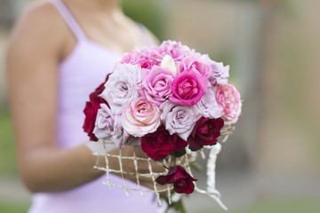 girl holding bouquet of roses