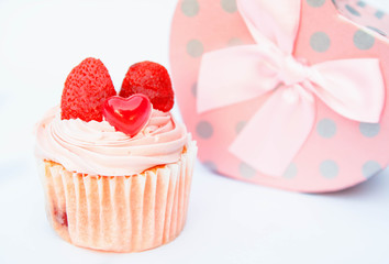 Delicious strawberry cupcakes with heart-shaped jelly are perfect for Valentine's Day backgrounds.