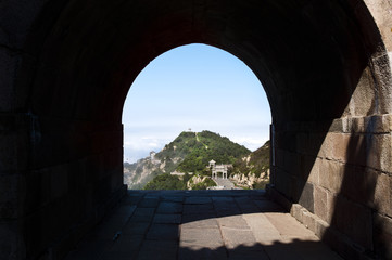 A stone archway gives a view of one of Tai Shan's summit peaks in Shandong Province, China
