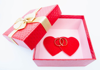 Red Heart with rings in a gift box with rings