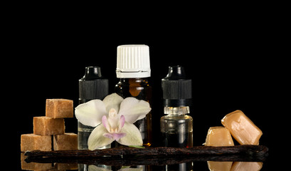 Vanilla caramel liquid for electronic cigarette isolated on black