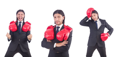 Businessman with boxing gloves on white