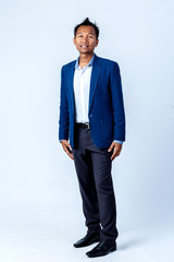 businessman asian  in blue suit studio portrait