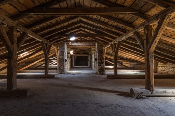 Creepy attic interior at abandoned building