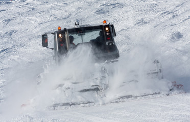 snow groomer in work