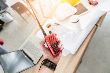 hand hold radio communication  with working table background