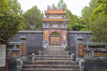 stairs and gate leading to Tu Duc emperor tomb in Hue Vietnam