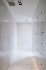 white corridor and locker with natural light