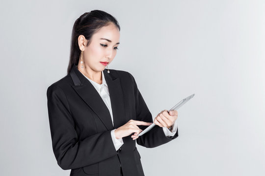 asian business woman with action pose in studio with white background