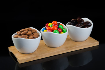 almond, chocolate and date on a background