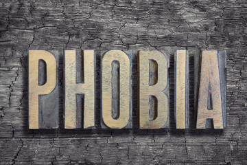 Fototapeta premium phobia word burned wood
