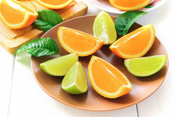 Orange slices with leaves on white
