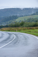 Fototapeta premium empty asphalt road in the countryside in autumn