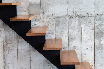 modern structure stair with wooden step and concrete texture background with free copyspace for...