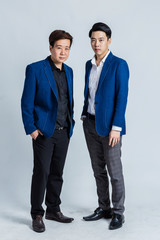 two asian smart business man in blue suit isolate white background