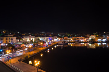 Fototapeta na wymiar Amazing view of the port and the city of Mytilene at night.Mytilene is the capital and port of the island of Lesvos and also the biggest island of the North Aegean.