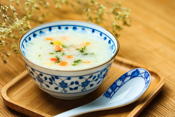 vegetable porridge in blue and white porcelain bowl