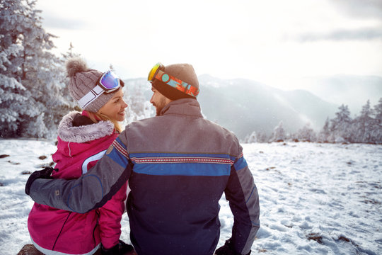 couple in love enjoying on winter vacation together on the mountain