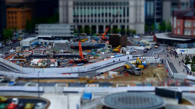 Tilt-shift aerial time-lapse shot of construction site at Tokyo station