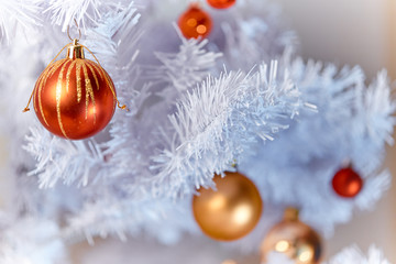 Red and Golden Christams Balls hanging on a white christmas tree - 178540629