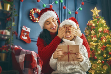Mother and daughter exchanging gifts