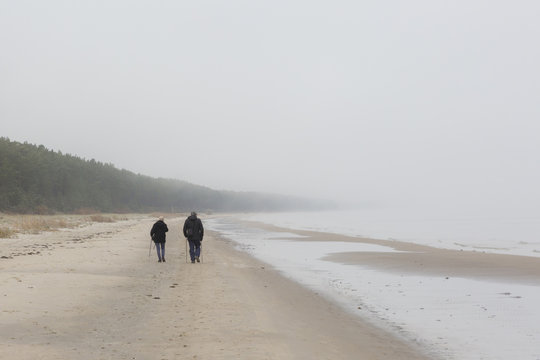 , In the fog. Autumn morning. Mist fell on the beach, all concealed gloomy haze. All lost the contours and shape.