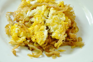 fried egg with sweet pickled radish on plate