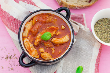 Chicken stew in tomato sauce with vegetables