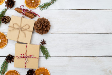 Christmas background with decorations and gift boxes on wooden board. Copy space