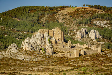 Medieval castle of Loarre over the rocks against mountains