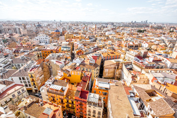 Fototapeta na wymiar Top cityscape view on the old residential buildings in Valencia city during the sunny day in Spain