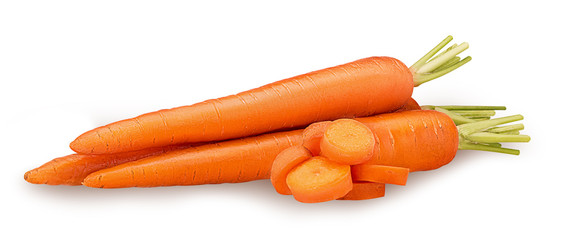 Heap of fresh clean carrots with slices, green stems.