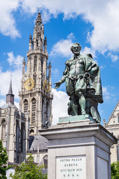Statue of Peter Paul Rubens by Willem Geefs 1805-1883 against Cathedral tower in Antwerp, Belgium
