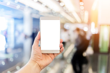 hand and screen smartphone with blur electric light background, smart home lighting control technology concept.