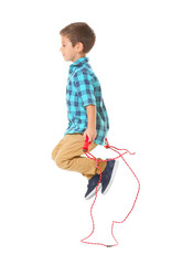 Adorable boy skipping rope, isolated on white