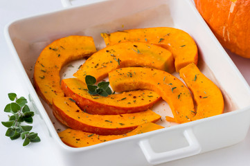Pieces of pumpkin on a tray.