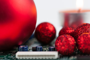 Christmas decoration on computer circuit board isolated on white.