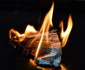 Newspapers in flames