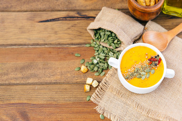 bowl of delicious pumpkin soup. Top view