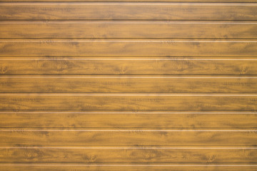 Wall of horizontal brown wooden panels for the background
