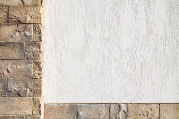 White wall decorated with a stone for the background.