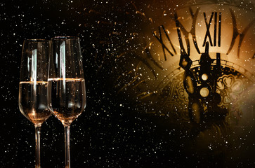 Night sky with clock and champagne for new year