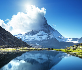 Naklejka na ściany i meble Reflection of Matterhorn in lake Riffelsee, Zermatt, Switzerland