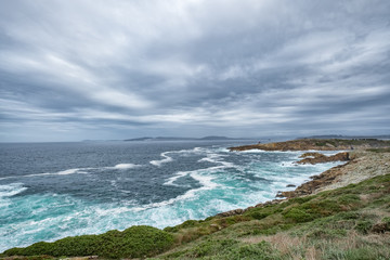sea cave framing a beautiful beach at sunrise
