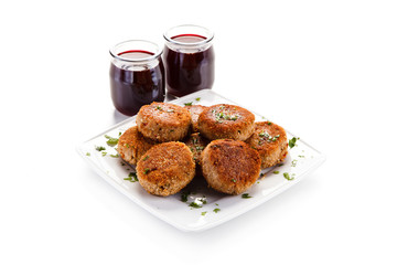 Meatballs with beet soup on white background